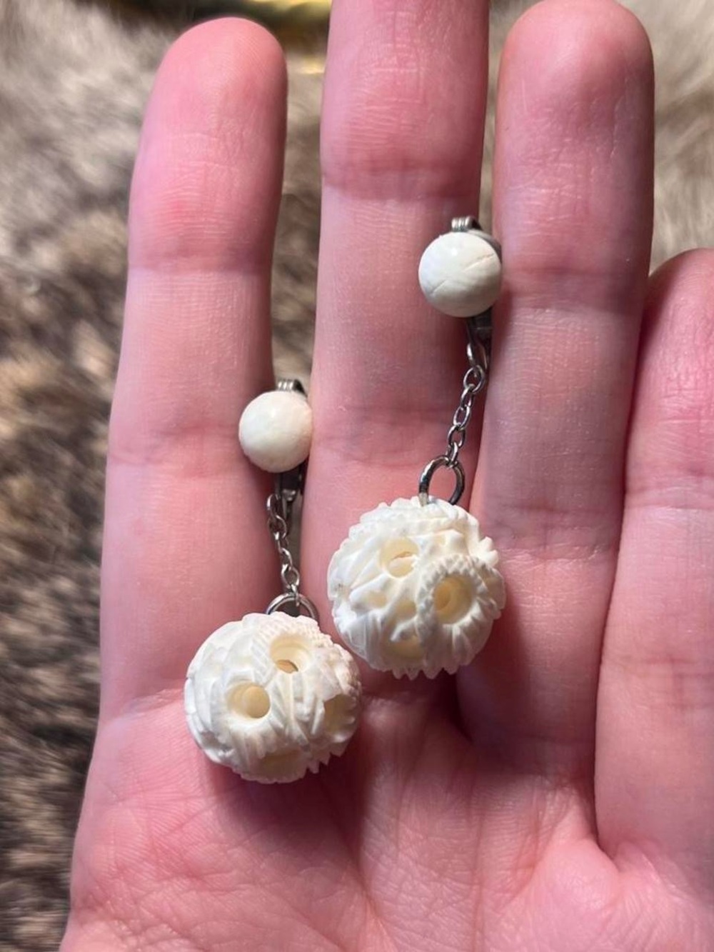 Carved bone moving ball drop earrings